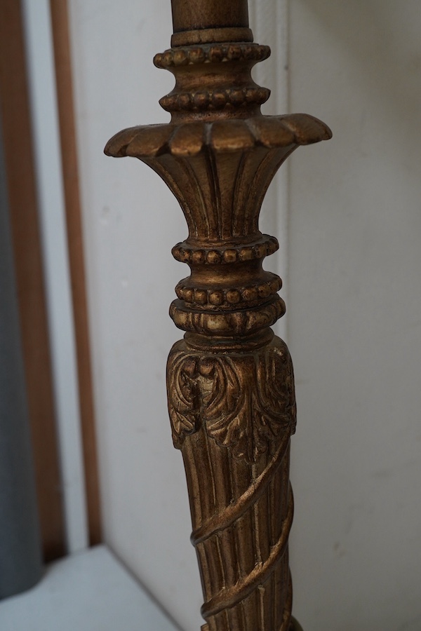 A pair of gilt resin table lamps with white shades, 76cm high. Condition - fair to good.